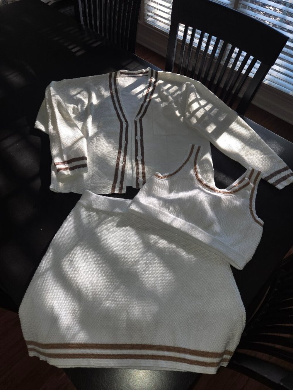 Set of knit-fabric tennis skirt, top and matching cardigan jacket in white/taupe